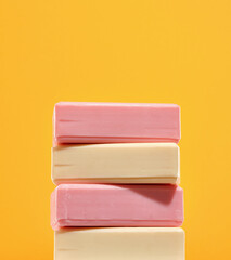 Several pieces of white and pink soap lying on top of each other. Organic natural product.