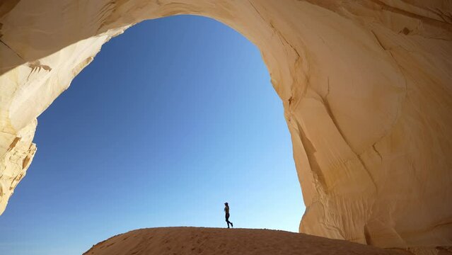 Great Chamber, Great Staircase Escalante National Monument Utah USA, Female Silhouette Walking Under Natural Landmark