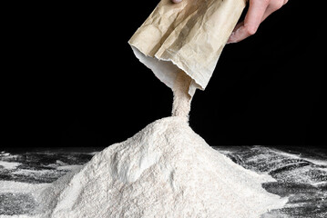 Chef pouring flour on table. Preparing dough for bread or pizza. - 633221866