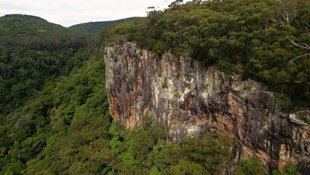 Aerial over cliff face on the Twin Falls walk, Springbrook National Park, Gold Coast Hinterland, Queensland, Australia
