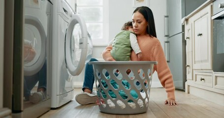 Woman, baby in arms with laundry and basket, loading clothes in washing machine and household chores. Mother, sleeping child and housekeeping, childcare and cleaning clothing with electric appliance