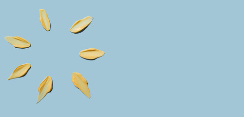 Cosmetic smear of cream texture in the form of rays of the sun on a blue background. Sunscreen cream. Copy space.