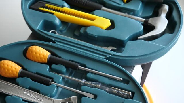 Rotation of opened case with tools and equipment for electrician detailed 4K video