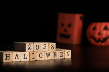 halloween 2023 concept on cubes and pumpkin