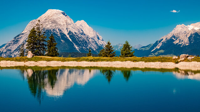 Alpine summer view with reflections at Lake Kaltwassersee, Mount Seefelder Joch, Rosshuette,  Seefeld, Tyrol, Austria