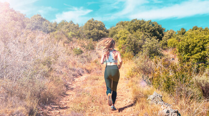 Fototapeta premium Woman running in the nature- sport, active, training concept