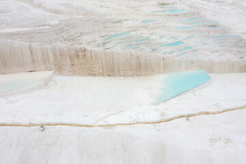 Carbonate travertines the natural pools during sunset, Pamukkale, Turkey