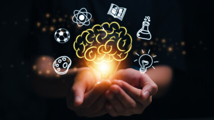 Hands holding brain with education icons, innovative technology in science, and communication concepts. creativity concept