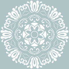 Oriental pattern with arabesques and floral elements. Light blue and white traditional classic ornament. Vintage pattern with arabesques