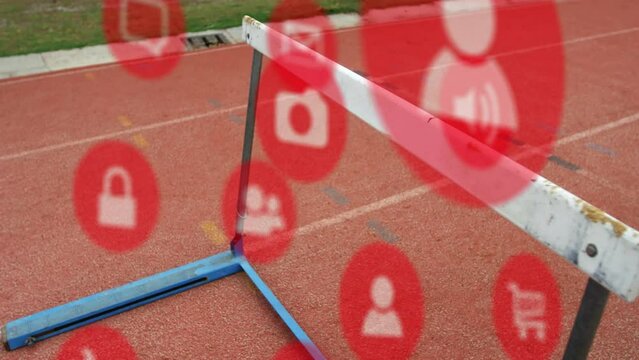 Animation of multiple icons over close-up of hurdle on race track in background