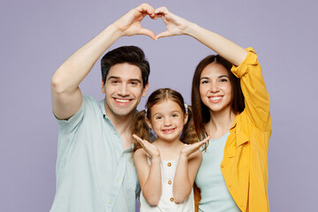 Young parents mom dad with child kid daughter girl 6 year old wear blue yellow casual clothes show...