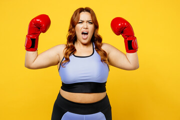 Young chubby overweight plus size big fat fit woman wear blue top red gloves warm up training...