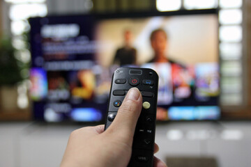 Cord Cutters Watching tv and using remote control