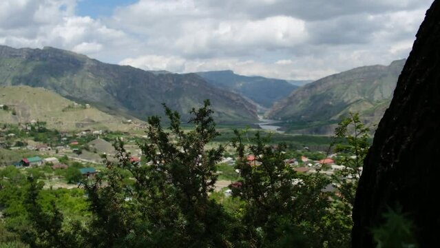 The view of the Caucasus mountains and village.
