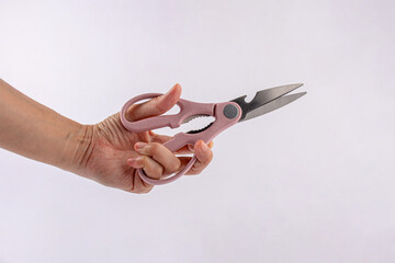 Office stationery scissors cutting in hand on white background