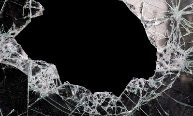 hole in broken glass with black background