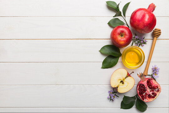 Flat lay composition with symbols jewish Rosh Hashanah holiday attributes on colored background, Rosh hashanah concept. New Year holiday Traditional. Top view with copy space