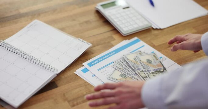 Insurance claim form and compensation for money accidents and insurance. Person receives monetary compensation