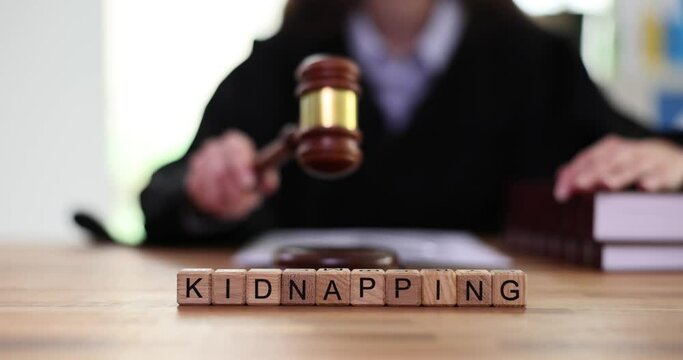 Text is kidnapping and judge knocks gavel in court. International child abduction controversy