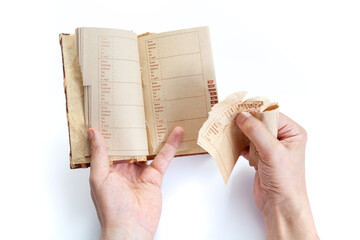 Hands of  man tearing page out of notebook close-up.. - obrazy, fototapety, plakaty