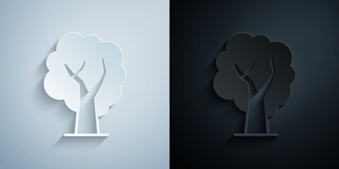 Paper cut Tree icon isolated on grey and black background. Forest symbol. Paper art style. Vector