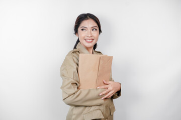 A Young beautiful Asian worker with brown uniform bringing document. Indonesian PNS.