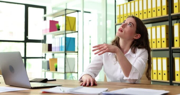 Woman without money in purse at workplace. Minimum wage and cash debt