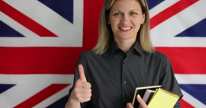 Student woman showing thumbs up sign on british flag background. Teaching English and University of London