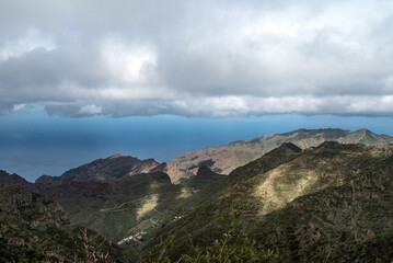 Naklejka premium Summer landscape of green mountains and blue sky