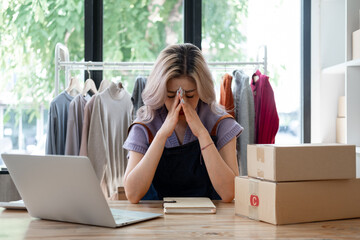 Business owner SME Small business stress depress serious about own online shop,  Young owner...