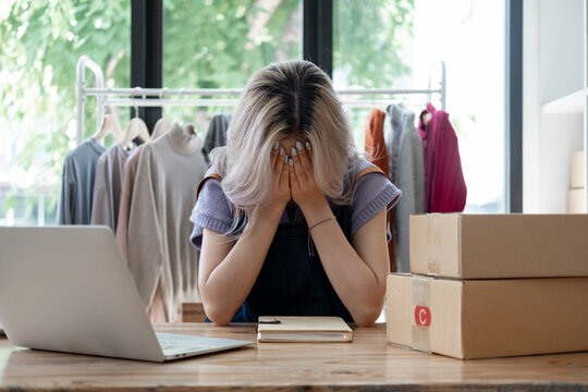 Business owner SME Small business stress depress serious about own online shop,  Young owner business angry sad disappointed with her business