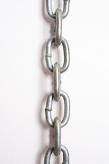 Metal chains on a white background.