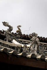 sculptures details of the house roof in Yu garden in Shanghai, China