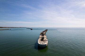 An aerial shot of several abandoned cargo vessels dating back to World War 2