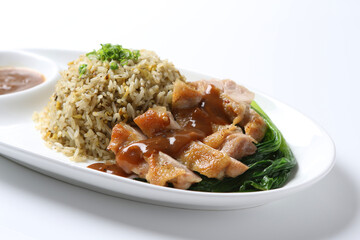 wok garlic olive fried egg rice with grilled chicken chop cutlet in brown sauce and vegetables in plate on vintage table cloth white background asian chef cuisine halal food menu for cafe