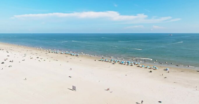 Aerial view of the beautiful silver beach in Beihai, Guangxi, China under the blue sky and white clouds