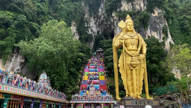 Panoramic view of Batu Caves temple and the giant Murugan statue, Hindu God of war, in Kuala Lumpur, Malaysia.