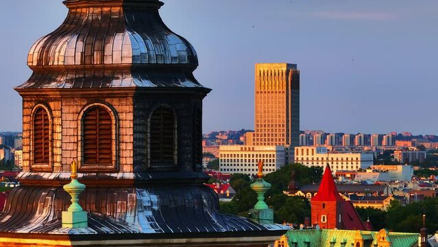 Medieval Town hall Tower with skyscraper in background. Krakow, Poland, Europe.