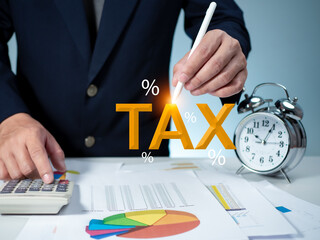 Businessman calculating income To fill out an online personal income tax return form to pay taxes....