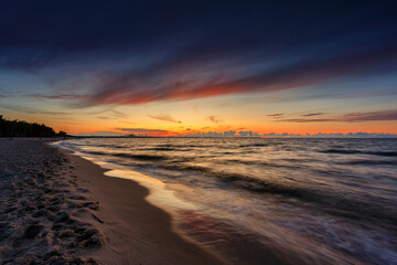 Fototapeta na wymiar Amazing sunset on the beach at Baltic Sea in Gdansk, Poland