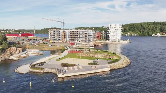 Aerial View Of Lokholmen Playground And Bathing Spot With Building Under Construction In The Background In Arendal, Norway.