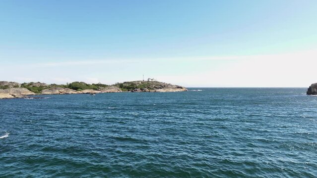 Distant View Of Stavernsodden Lighthouse Across The Sea In Larvik, Vestfold og Telemark, Norway. wide