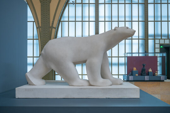 PARIS, FRANCE - APRIL 15, 2023: White Bear, French: Ours blanc, sculpture by Francois Pompon, 1927. Main hall of Orsay Museum, French: Musee d Orsay, in former train station building, Paris, France.