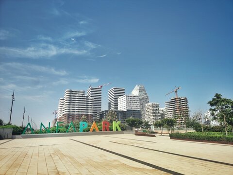Casablanca, Morocco - 19 July 2023 : View of  buildings of Casa Finance City aka CFC and Anfa park entry on a sunny day