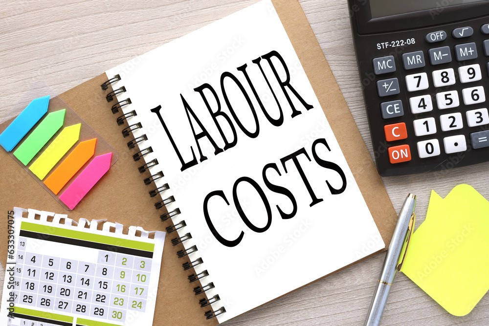 Poster labour costs open notebook with stickers and a calendar for the month. word on the page