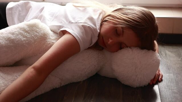 girl pretend to sleep over big plush toy
