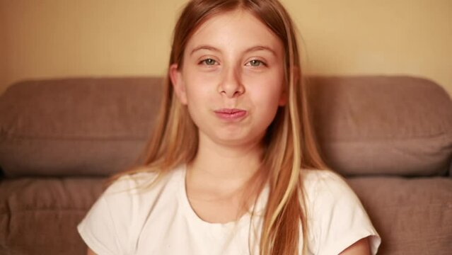 girl eat Muskmelon on the couch and smile