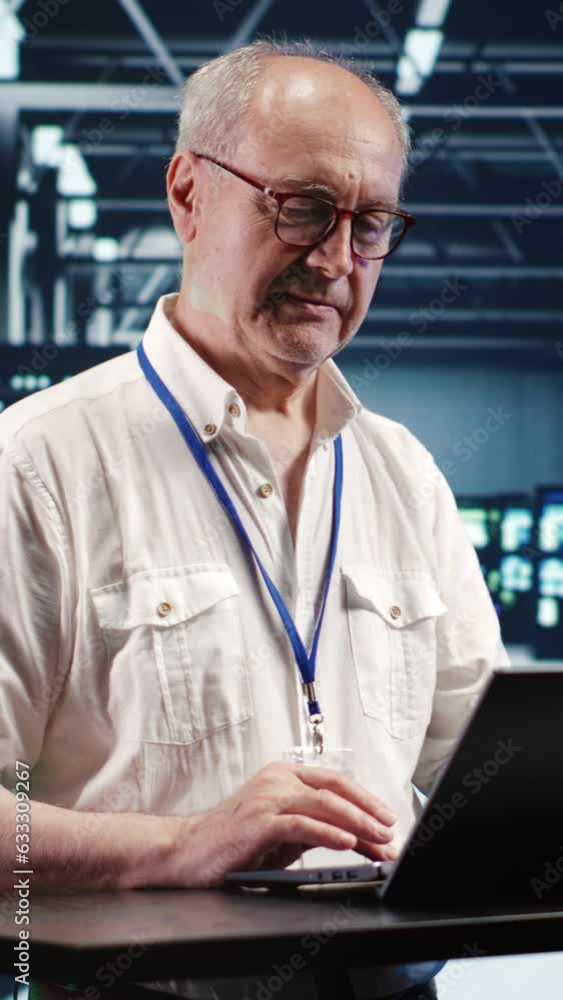Aufkleber vertical video skilled it professional expertly managing data while navigating in industrial server 