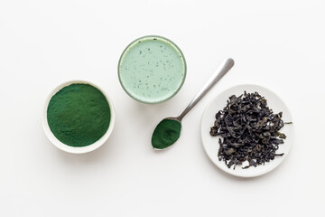 Spirulina algae powder and green latte, top view. Super food concept