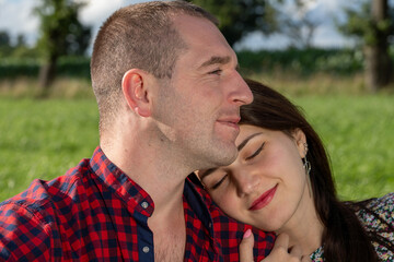 Loving couple at a picnic in the park.